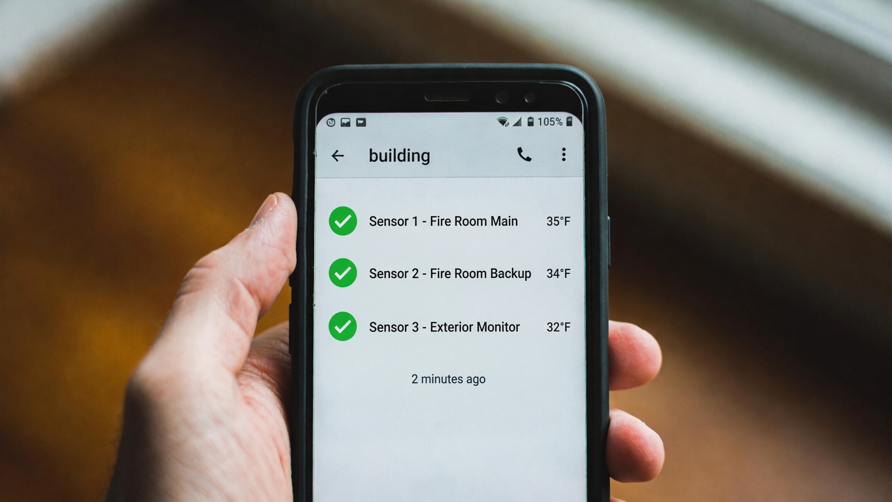 Phone showing Building Sensor readings and alerts